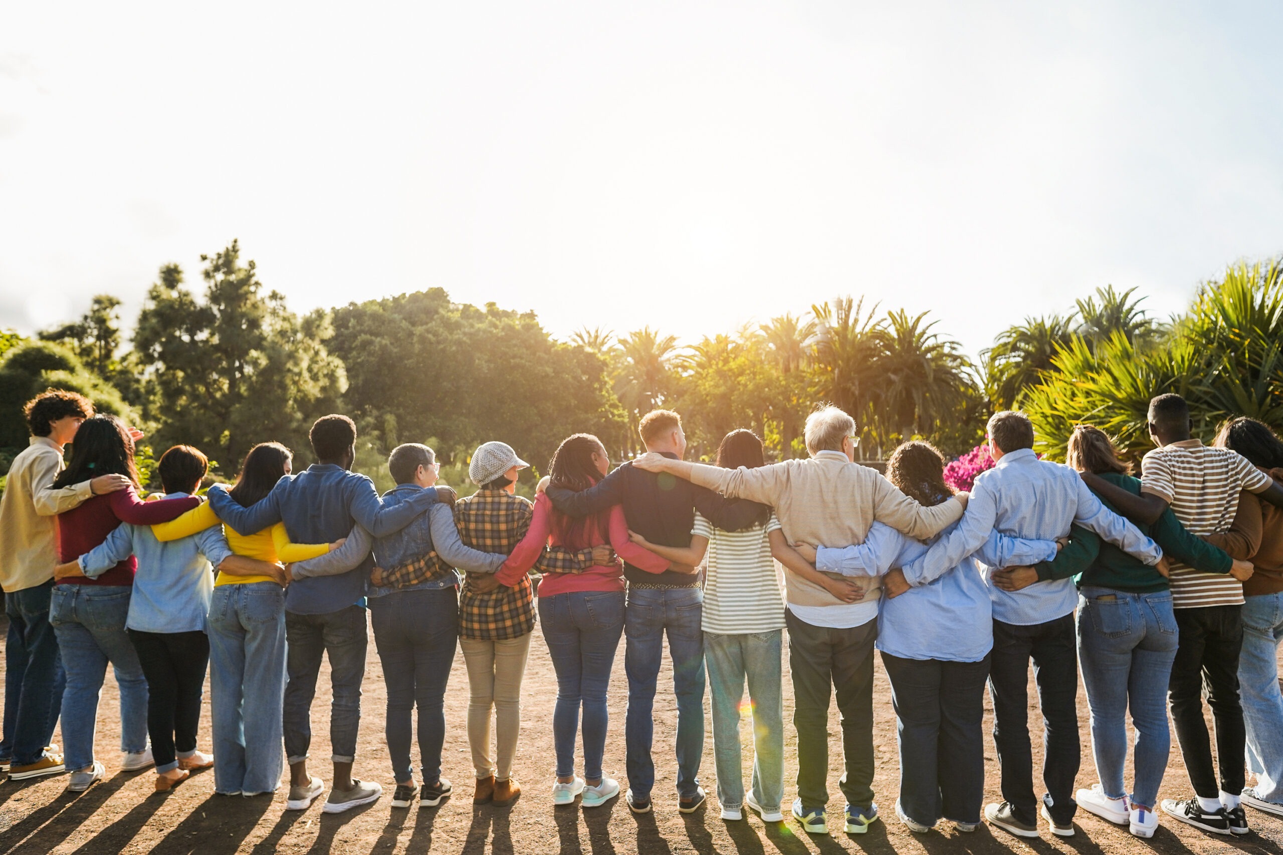 Group of multigenerational people hugging each others - Support,